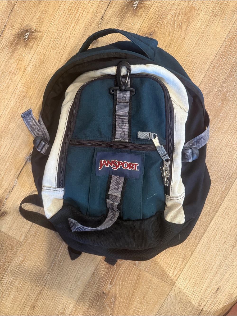 JanSport Black, Dark Green & Cream Backpack with Front Pocket